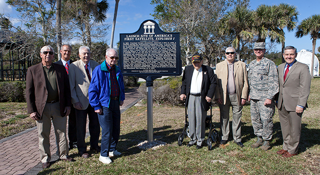 Launch team members who supported the launch of America's first satellite, Explorer 1, pose at a newly unveiled historical marker.